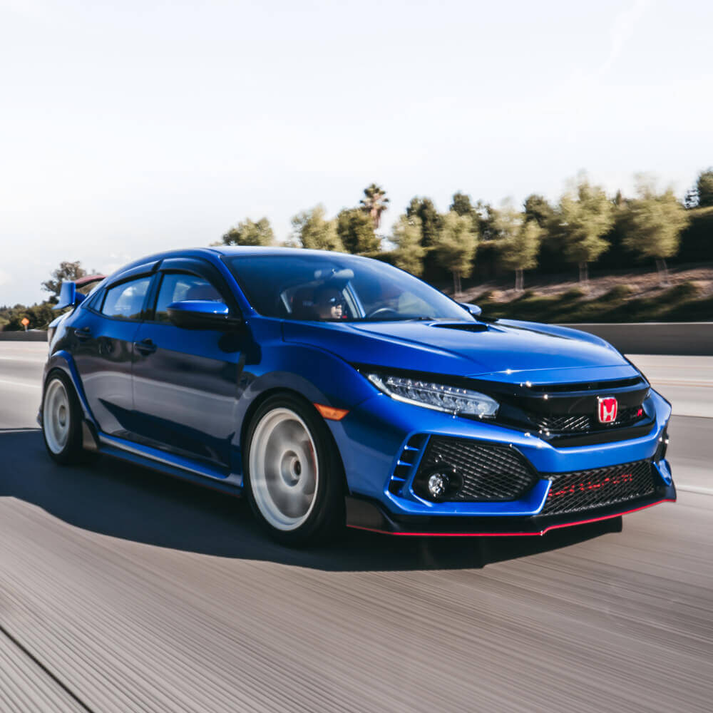 Blue Civic Type R driving down the road